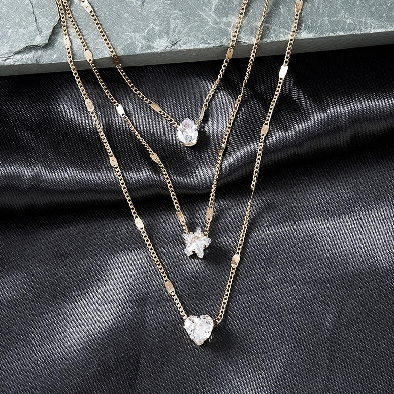 Drie-delige hanger ketting met gouden zirkonia