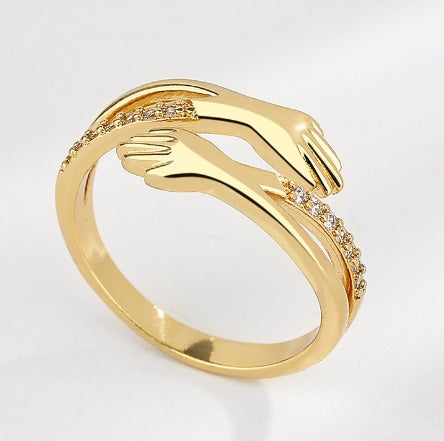 Verstelbare knuffelring met zirkonia in goud en zilver