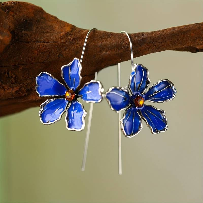Vintage oorbellen met blauwe bloem