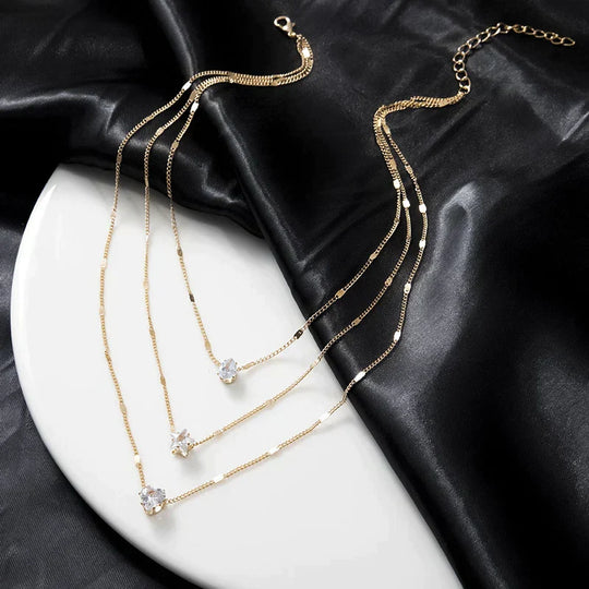 Drie-delige hanger ketting met gouden zirkonia